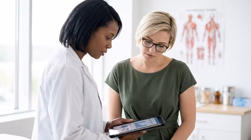 Parking: A doctor and patient during a consultation Doctor and patient consultation for Parking - How To Access Hendon: Private Microsuction Ear Wax Removal In North West Londo...