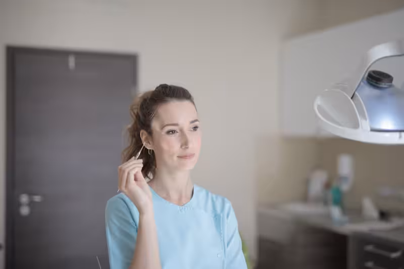 Book Your Microsuction Ear Wax Removal Appointment Today, And Say Goodbye to Ear Wax Discomfort: A doctor in a clinic Doctor in clinic for Book Your Microsuction Ear Wax Removal Appointment Today, And Say Goodbye to Ear Wax Discomfort - Coffe...