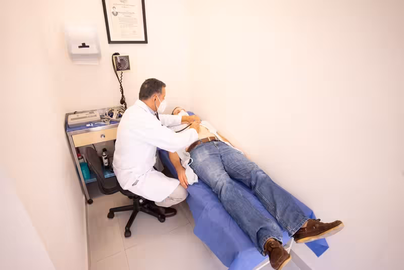 Aftercare and What to Expect Once the Wax Is Removed: A doctor in a clinic Doctor in clinic for Aftercare and What to Expect Once the Wax Is Removed - Fast Track Appointments At Ashford: Private Micr...